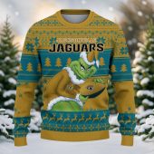 Jacksonville Jaguars Grinch Stolen Ugly Christmas Sweater Front - TeeUgly